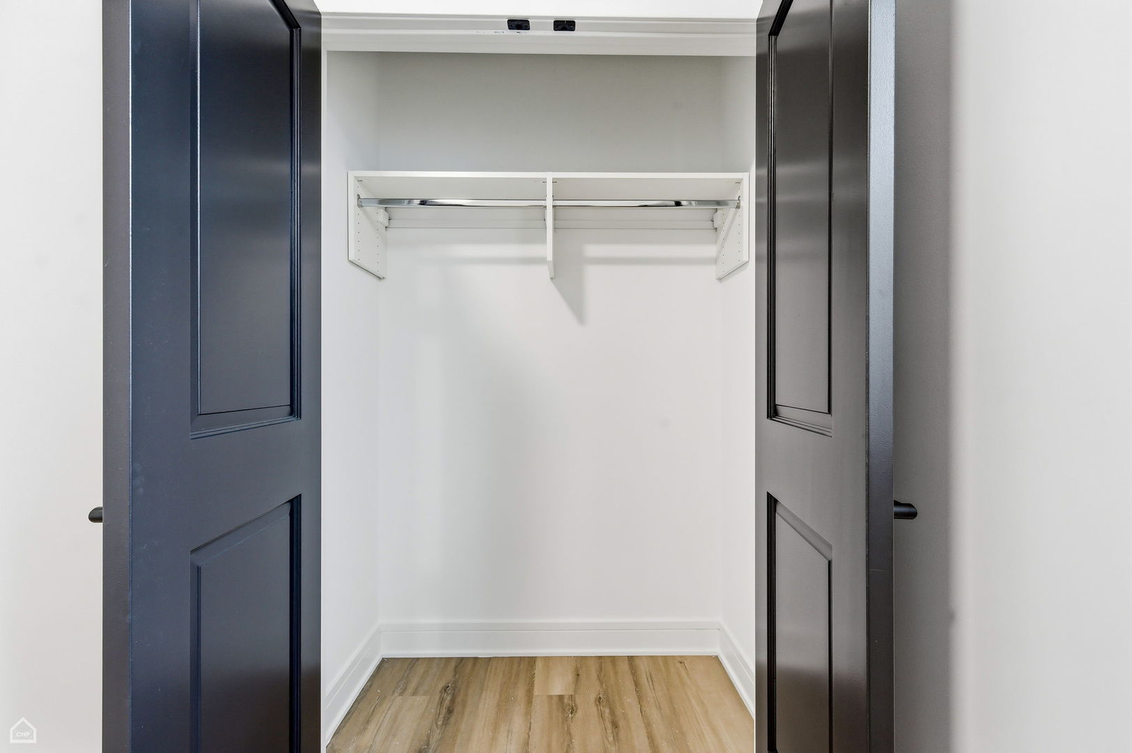 861 East 63rd Place, Unit 1 Chicago, IL 60637 - Photo 11 of 17 a view of walk in closet with wooden floor
