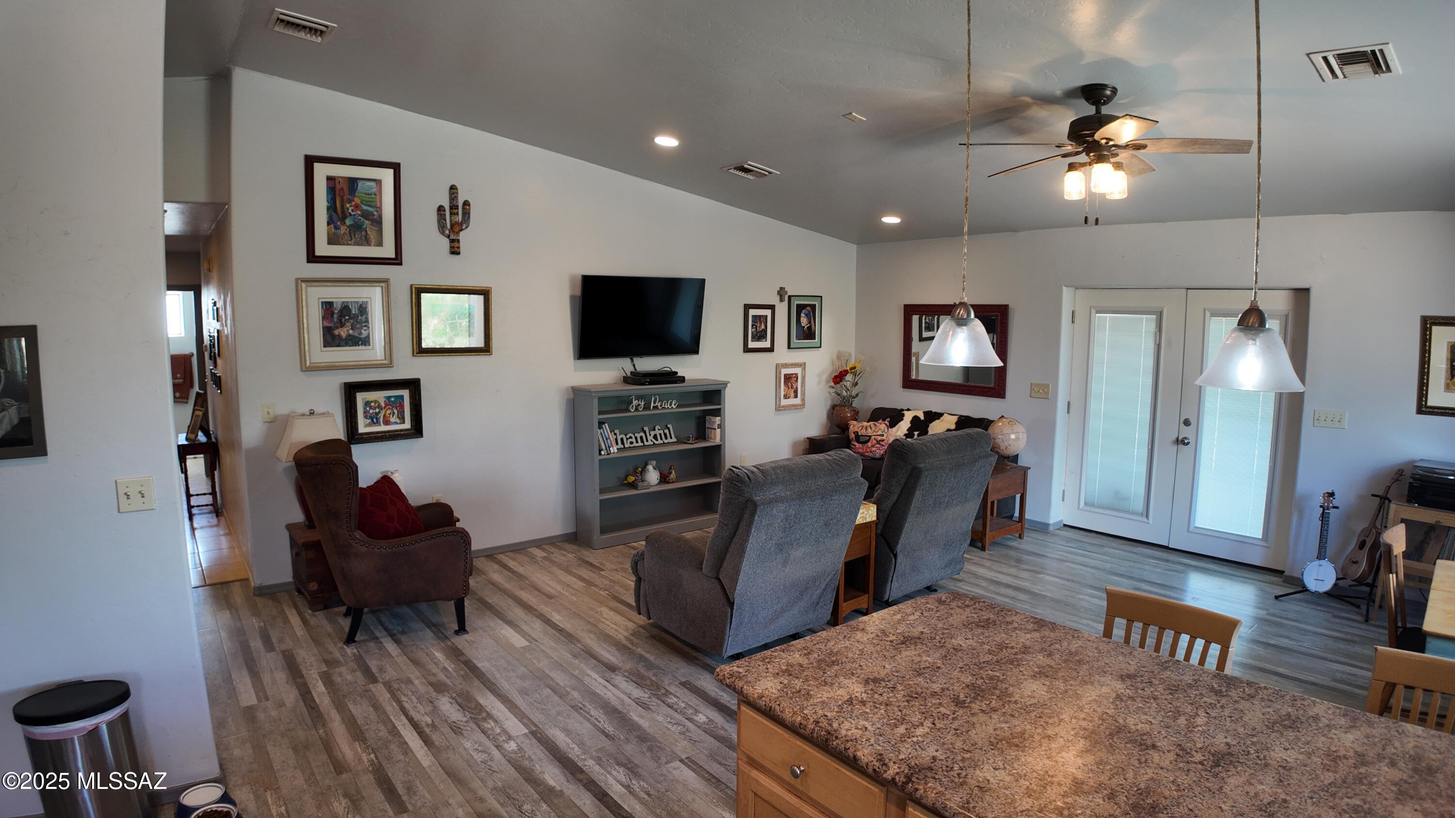 995 Jar Court Rio Rico, AZ 85648 - Photo 11 of 44 a living room with furniture and a flat screen tv