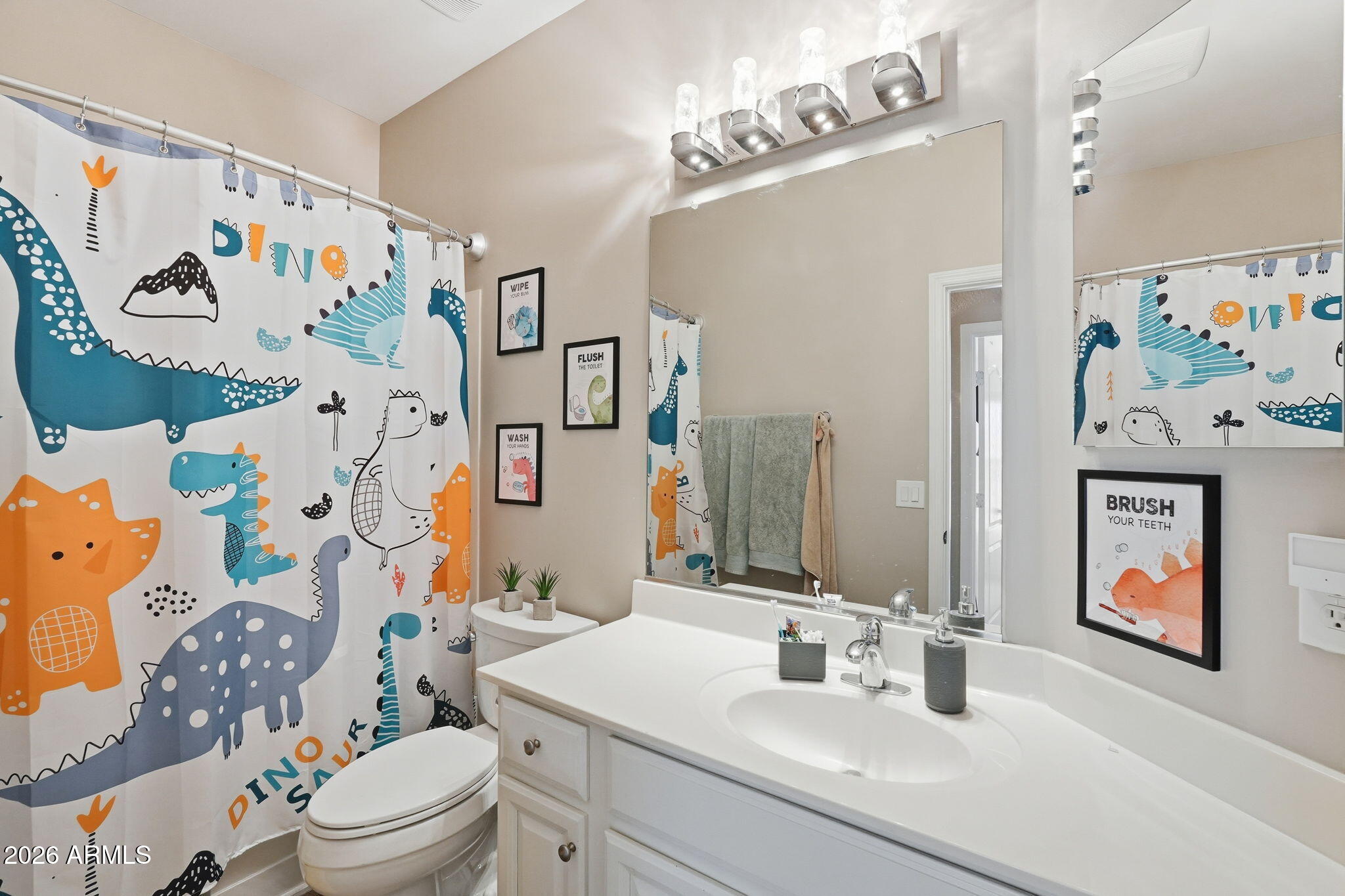 2829 East Park View Lane Phoenix, AZ 85024 - Photo 16 of 20 a bathroom with a sink mirror and a toilet