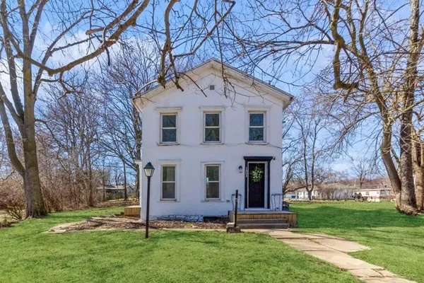 front view of a house with a yard