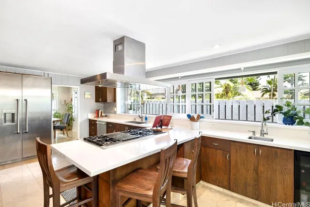 a kitchen with a table chairs stove and refrigerator