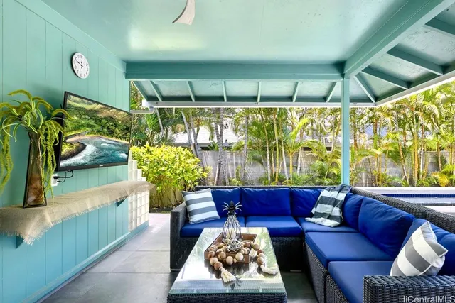 a living room with furniture and a rug