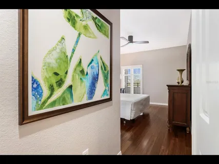 a bedroom with a bed and a night stand