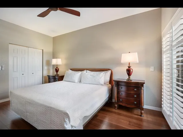 a bathroom with a granite countertop sink mirror and toilet
