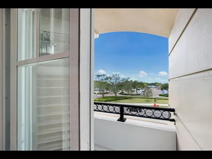a view of a livingroom with furniture and a window