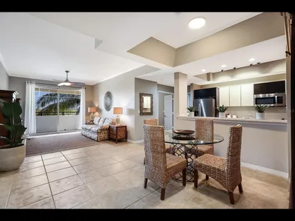 a view of a livingroom with furniture and a window