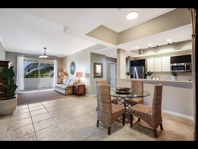 a view of a livingroom with furniture and a window