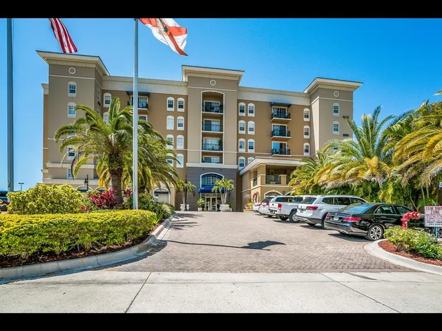 a view of a patio with table and chairs under an umbrella