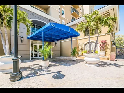 a view of a house with outdoor seating