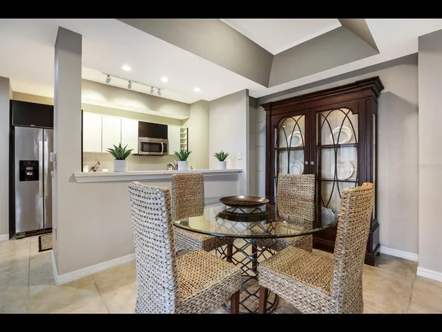 a kitchen with stainless steel appliances a refrigerator sink and stove