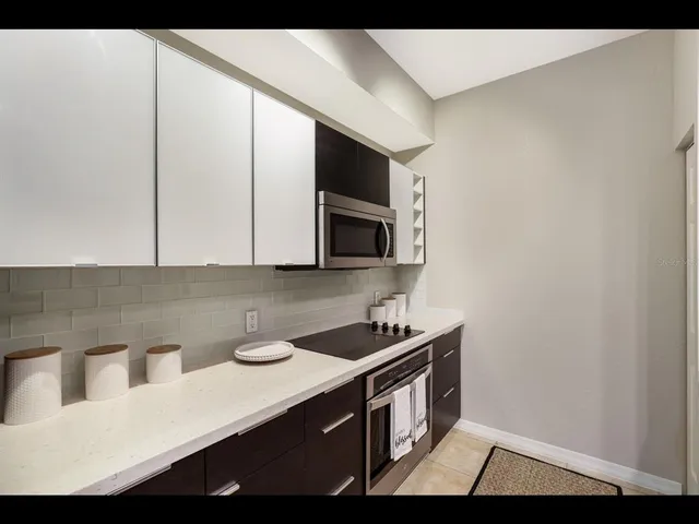 a kitchen with counter top space sink and center