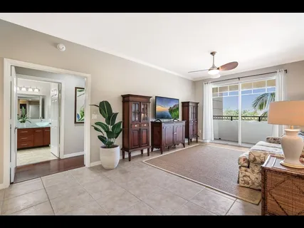 a living room with a couch and a dresser