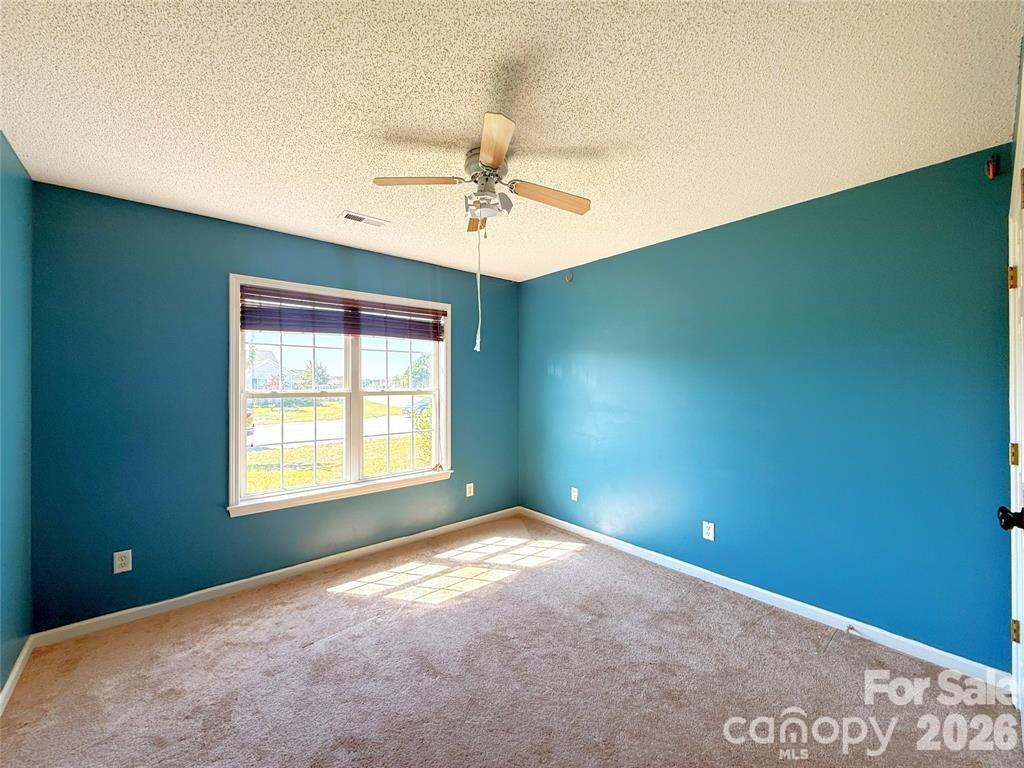 7456 Courtney Pines Road Wilmington, NC 28411 - Photo 13 of 16 a view of an empty room with a window