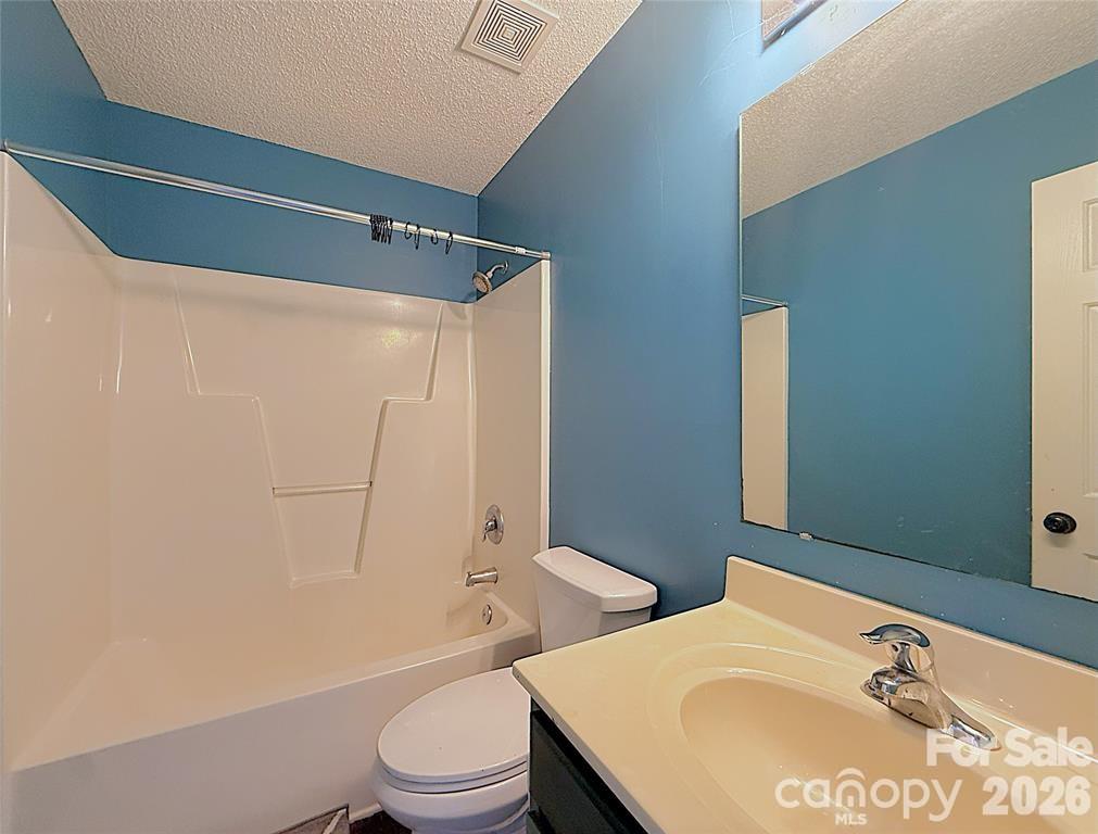 7456 Courtney Pines Road Wilmington, NC 28411 - Photo 15 of 16 a bathroom with a sink toilet and shower