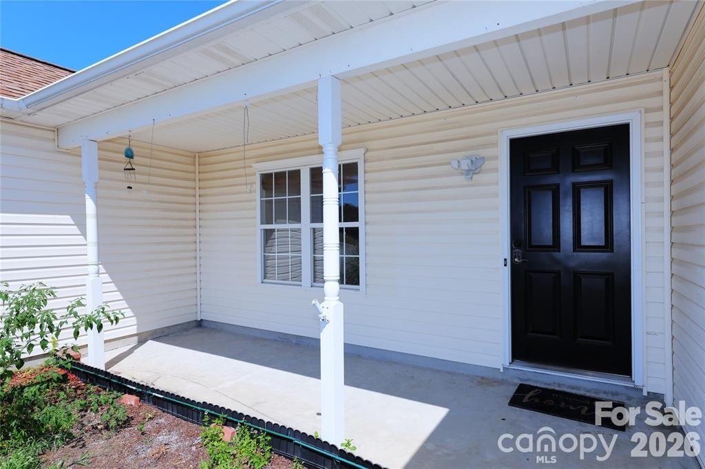7456 Courtney Pines Road Wilmington, NC 28411 - Photo 2 of 16 a view of house with entryway