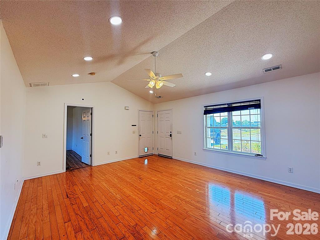 7456 Courtney Pines Road Wilmington, NC 28411 - Photo 8 of 16 a view of an empty room with a window