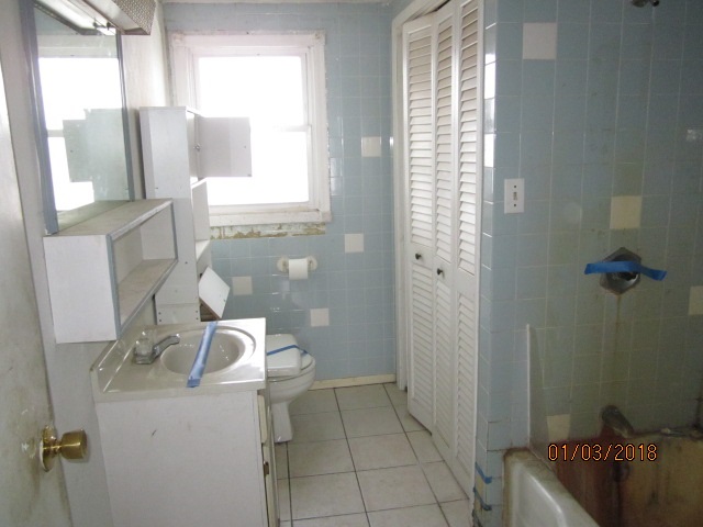 8982 East Maize Road Rock City, IL 61070 - Photo 17 of 25 a bathroom with a sink toilet and shower