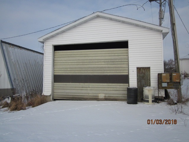 8982 East Maize Road Rock City, IL 61070 - Photo 2 of 25 a side view of a house with a garage