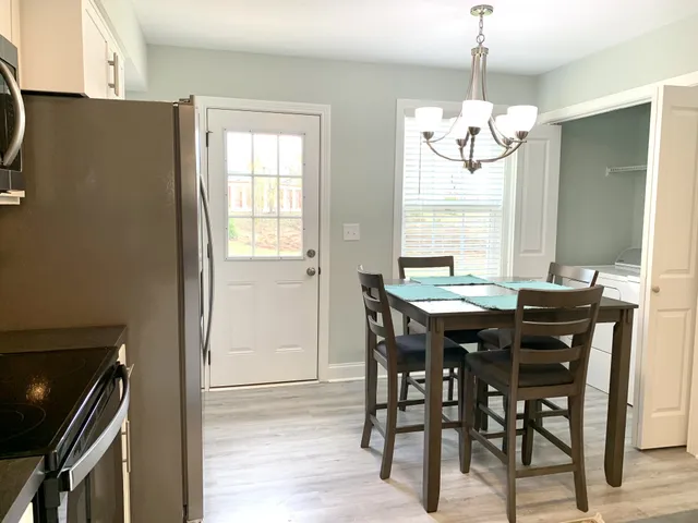 a view of a dining room with furniture window and outside view