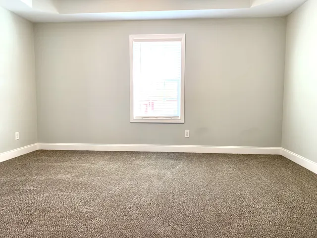 an empty room with closet area