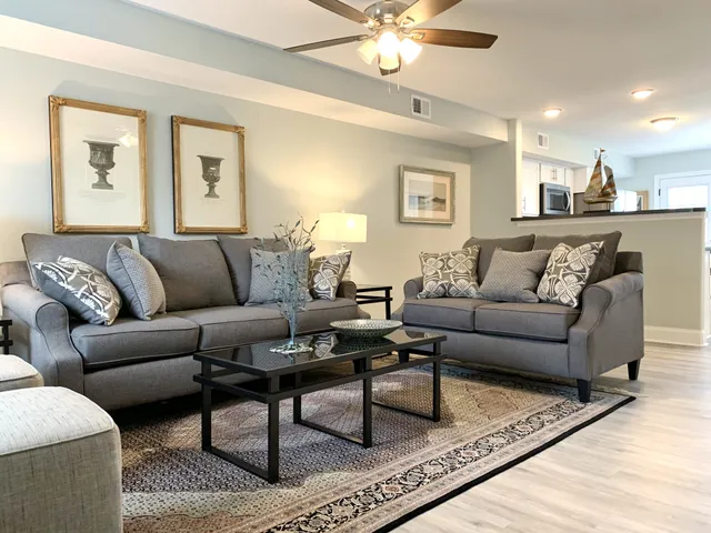 a living room with furniture and a lamp