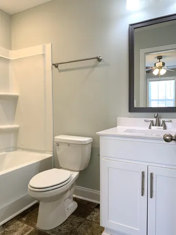 a bathroom with a sink a toilet and a bathtub