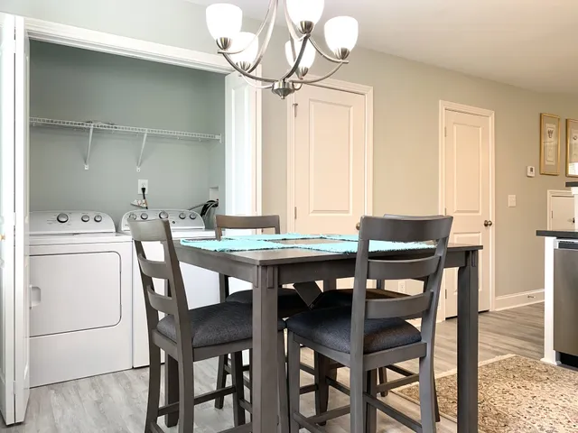 a dining room with furniture and window