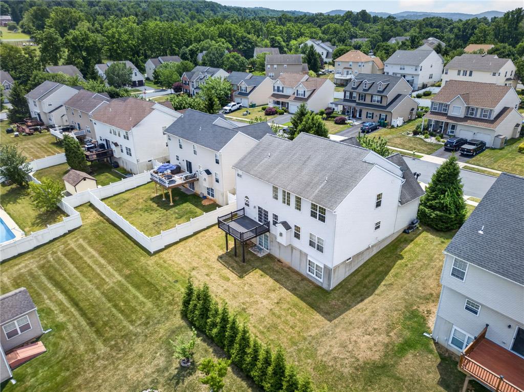 3821 Rittenhouse Road Lower Macungie Township, PA 18062 - Photo 9 of 62 An aerial perspective reveals numerous residences nestled within a lush, green community.