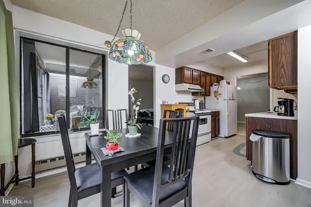 a kitchen with stainless steel appliances granite countertop a stove and a sink