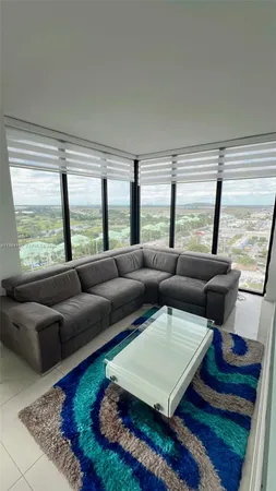 a large kitchen with a stove a refrigerator and a sink