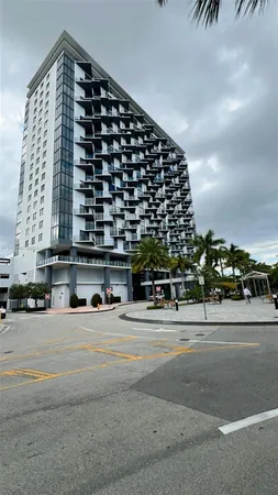 a tall building with view of street