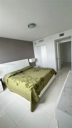 a view of a bathroom with a sink and a mirror