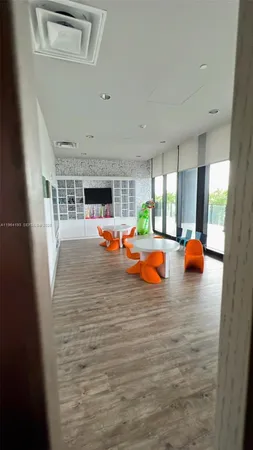 a lobby with furniture and floor to ceiling window