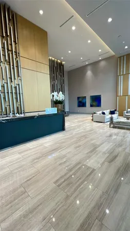 a view of kitchen with refrigerator and window