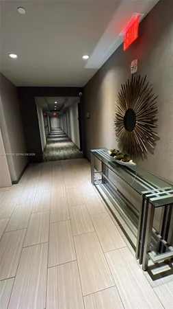 a kitchen with a sink stainless steel appliances and cabinets