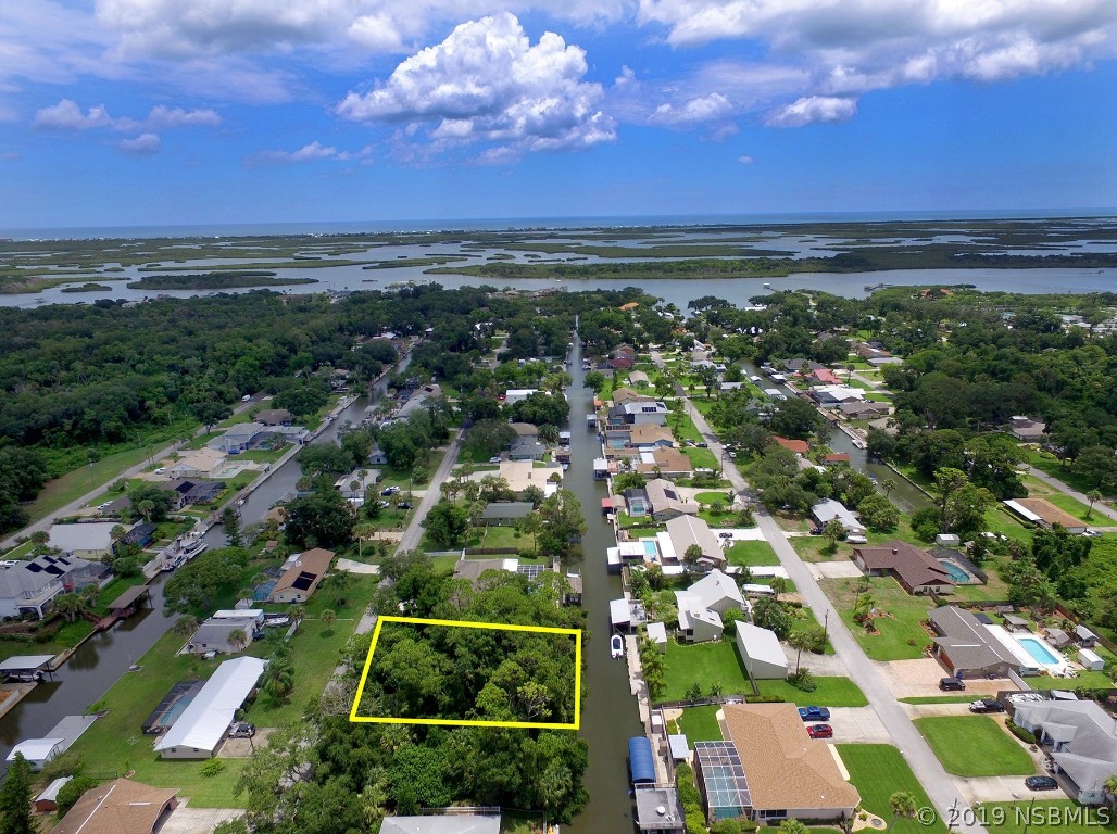 0 Azalea Road Edgewater, FL 32141 - Photo 4 of 8 an aerial view of residential houses with outdoor space and ocean view