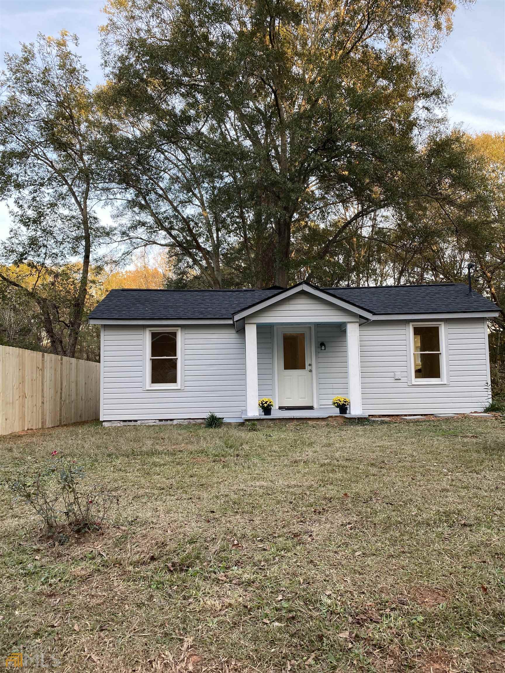 250 North 4th Street Colbert, GA 30628 - Photo 1 of 1 a house with a tree in front of it