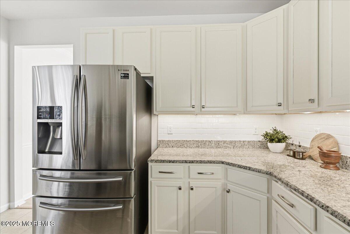 10 Sunshine Way Jackson, NJ 08527 - Photo 11 of 50 a kitchen with appliances a refrigerator and cabinets