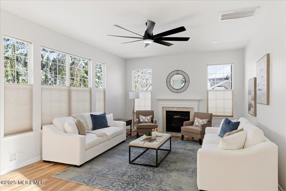 10 Sunshine Way Jackson, NJ 08527 - Photo 18 of 50 a living room with furniture a fireplace and a large window