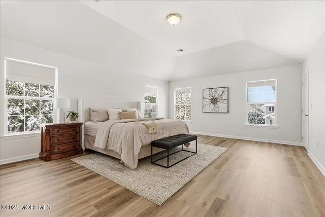 a bed room with a bed and a window