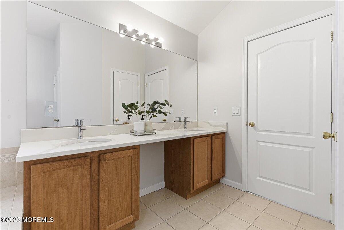 10 Sunshine Way Jackson, NJ 08527 - Photo 25 of 50 a bathroom with a sink and a mirror