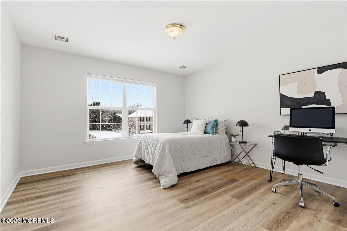 10 Sunshine Way Jackson, NJ 08527 - Photo 32 of 50 a spacious bedroom with a bed window and table