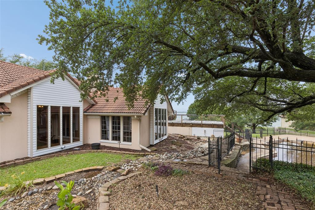 4 Eastshore Road Heath, TX 75032 - Photo 37 of 37 a front view of a house with garden