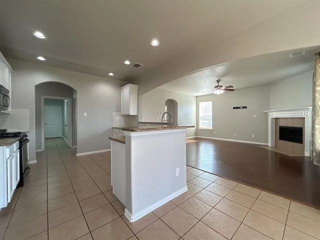 a kitchen with a sink cabinets and stainless steel appliances