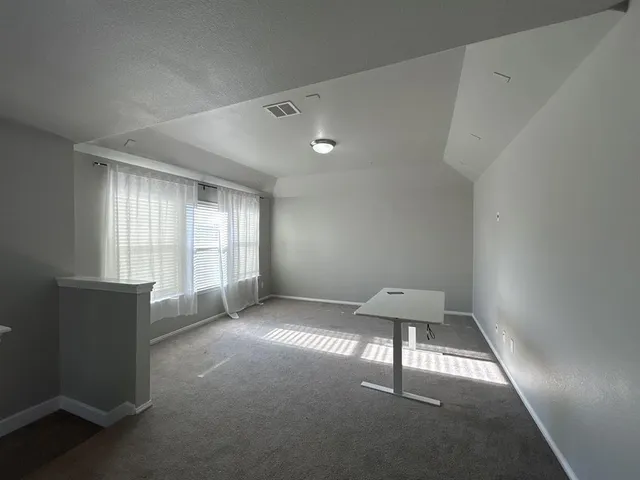 a view of an empty room and window