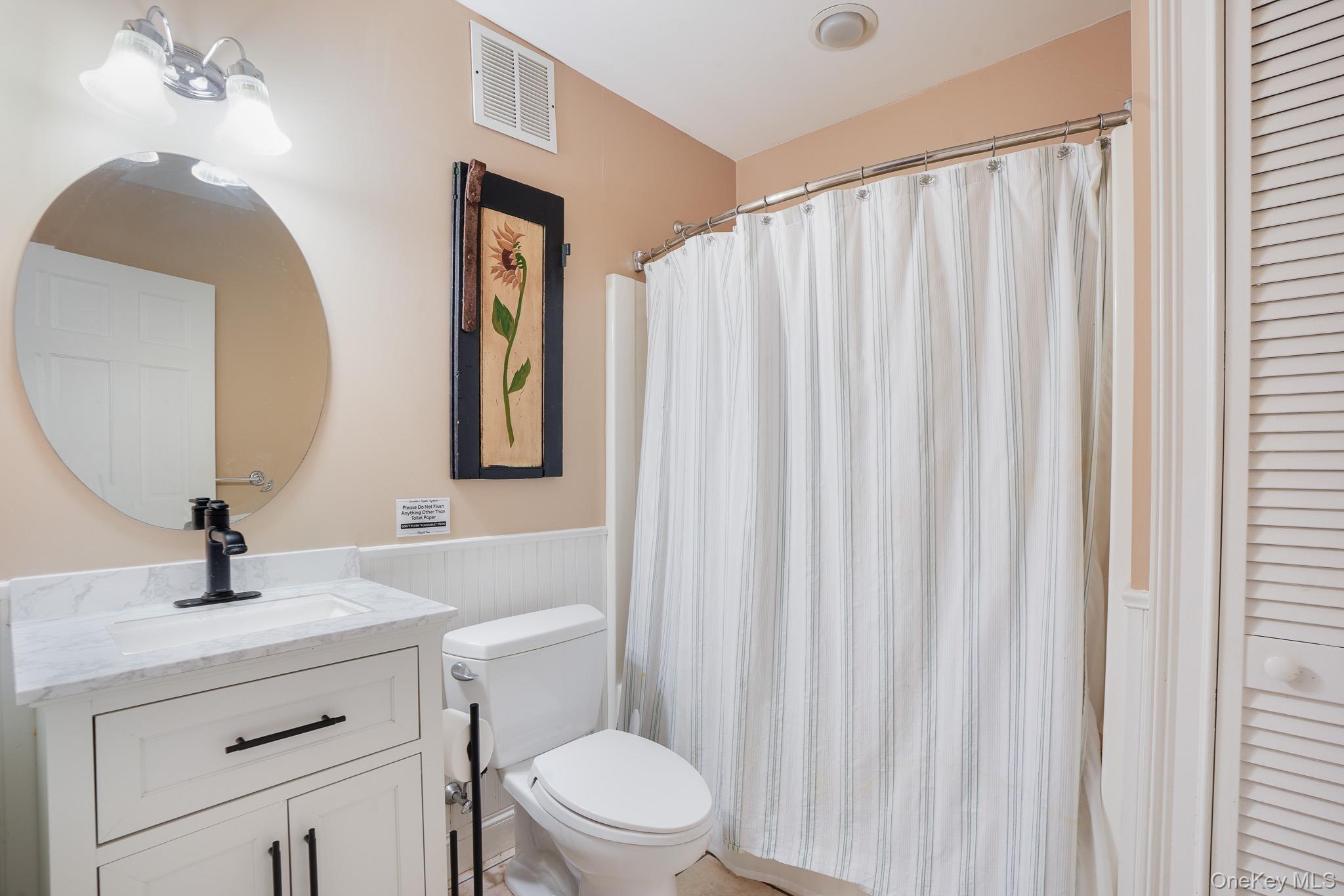 22 Ridgemont Drive Hopewell Junction, NY 12533 - Photo 37 of 43 a bathroom with a toilet a sink and a mirror