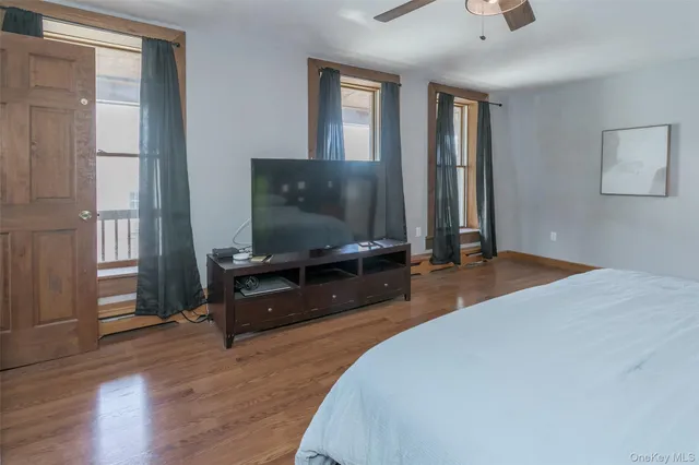 a bedroom with furniture and window