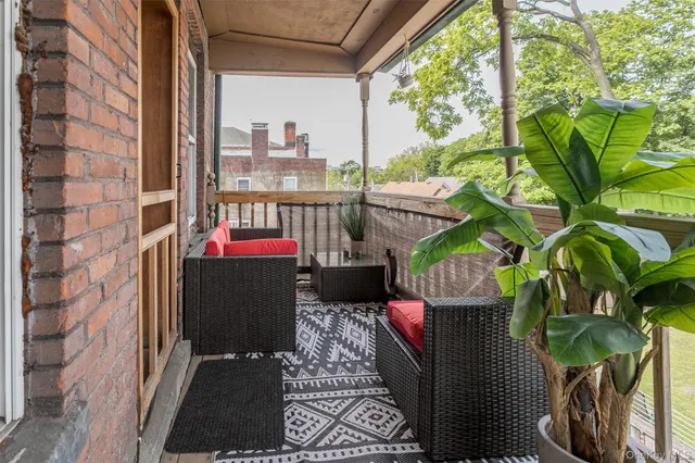 a balcony view with couple of chairs