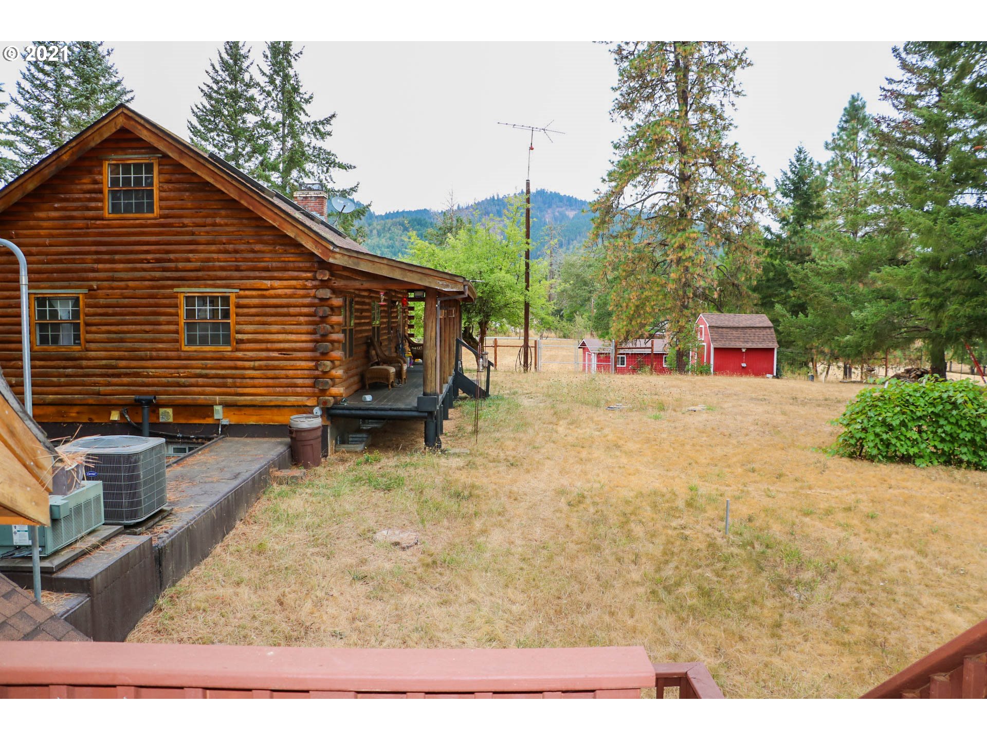 333 Coates Road Tenmile, OR 97481 - Photo 18 of 27 a view of a house with a backyard