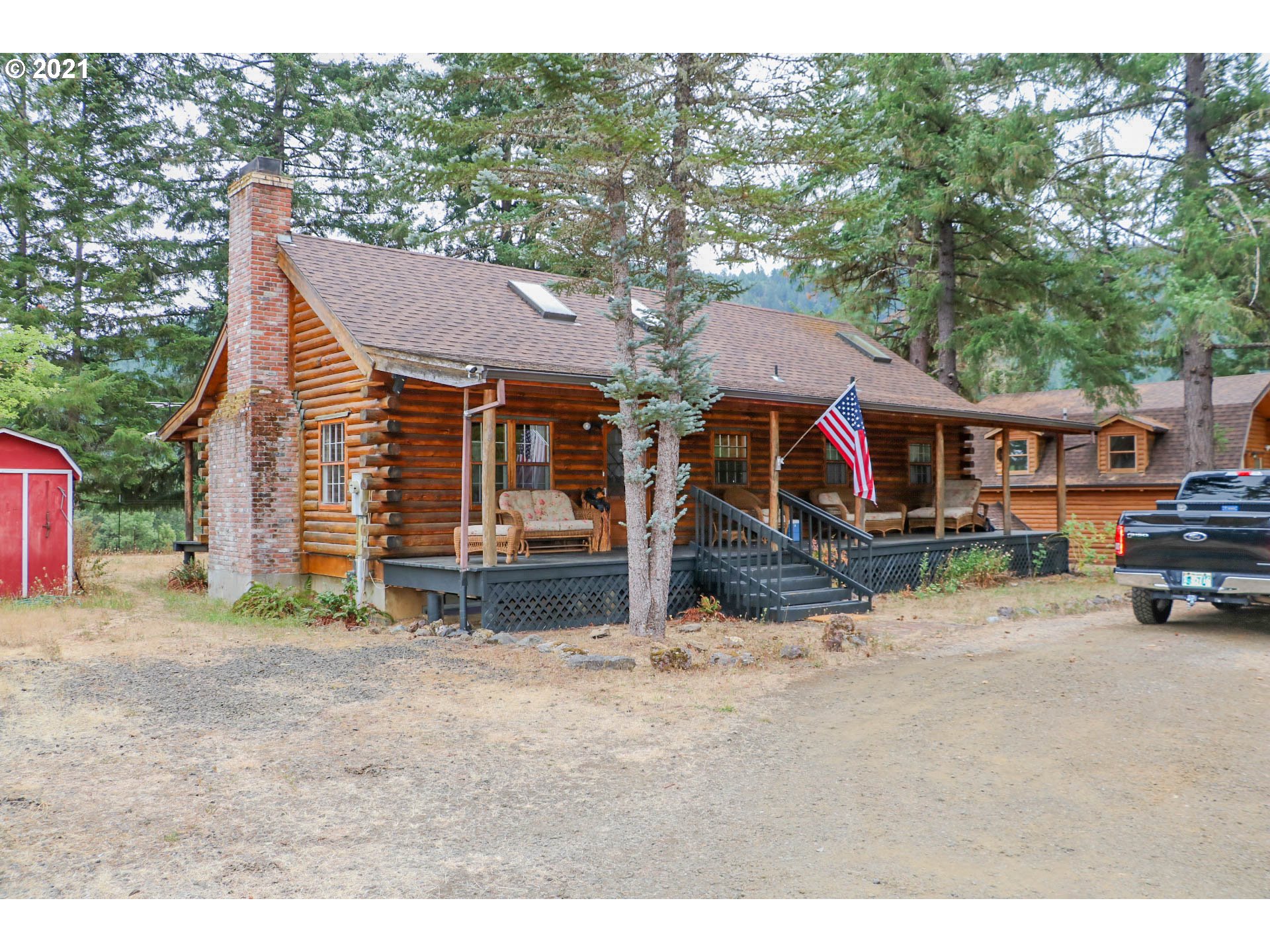 333 Coates Road Tenmile, OR 97481 - Photo 2 of 27 a view of a house with a patio